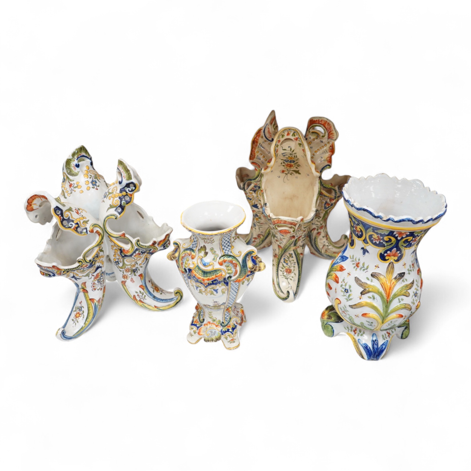 Two late 19th / early 29th century French faience vases and two similar centrepieces, largest 35cm high